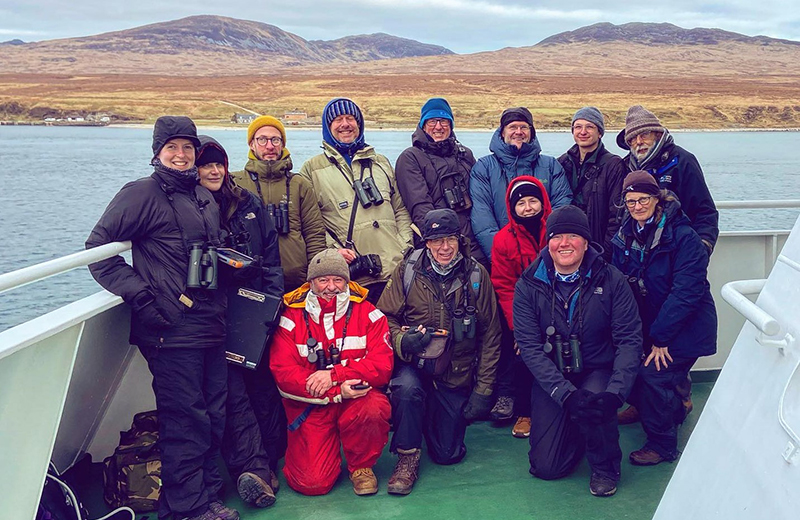 Photograph of Volunteer Seabirds at Sea (V S A S) trainees onboard a CalMac ferry.