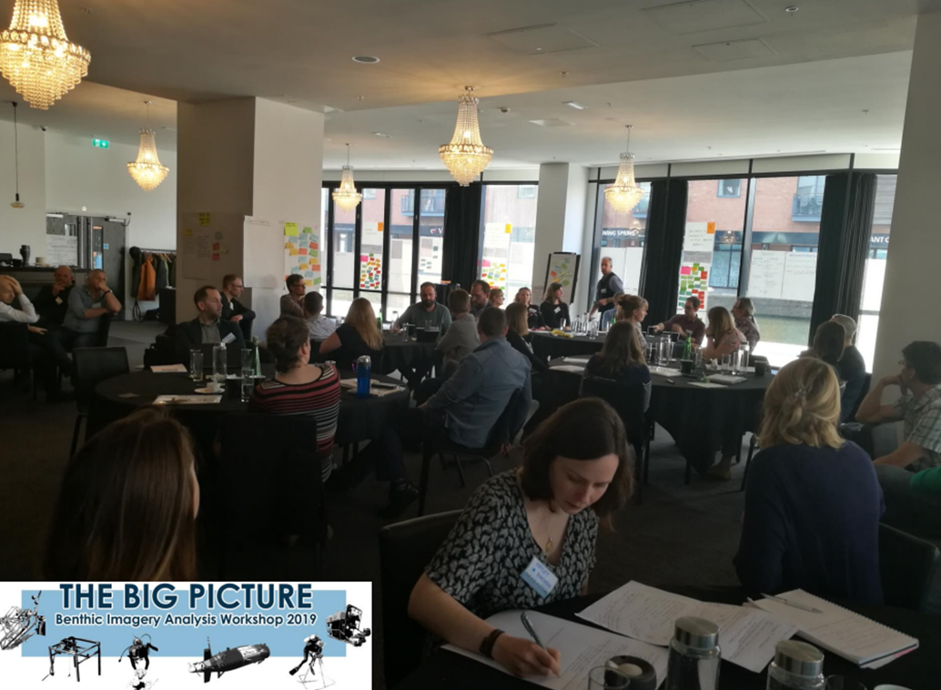 Photograph of attendees working at The Big Picture 2019 Workshop. Logo of The Big Picture is in bottom left corner.