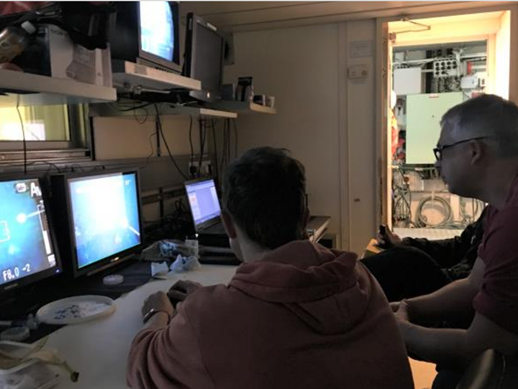 Image of staff working on computers on a survey