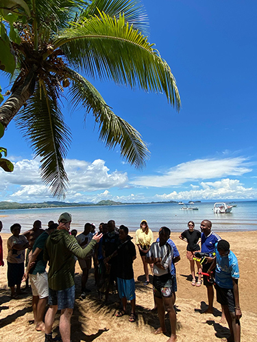 Attendees of a seagrass monitoring workshop receiving a final briefing before putting their new skill to the test (photo courtesy of Eirian Kettle)